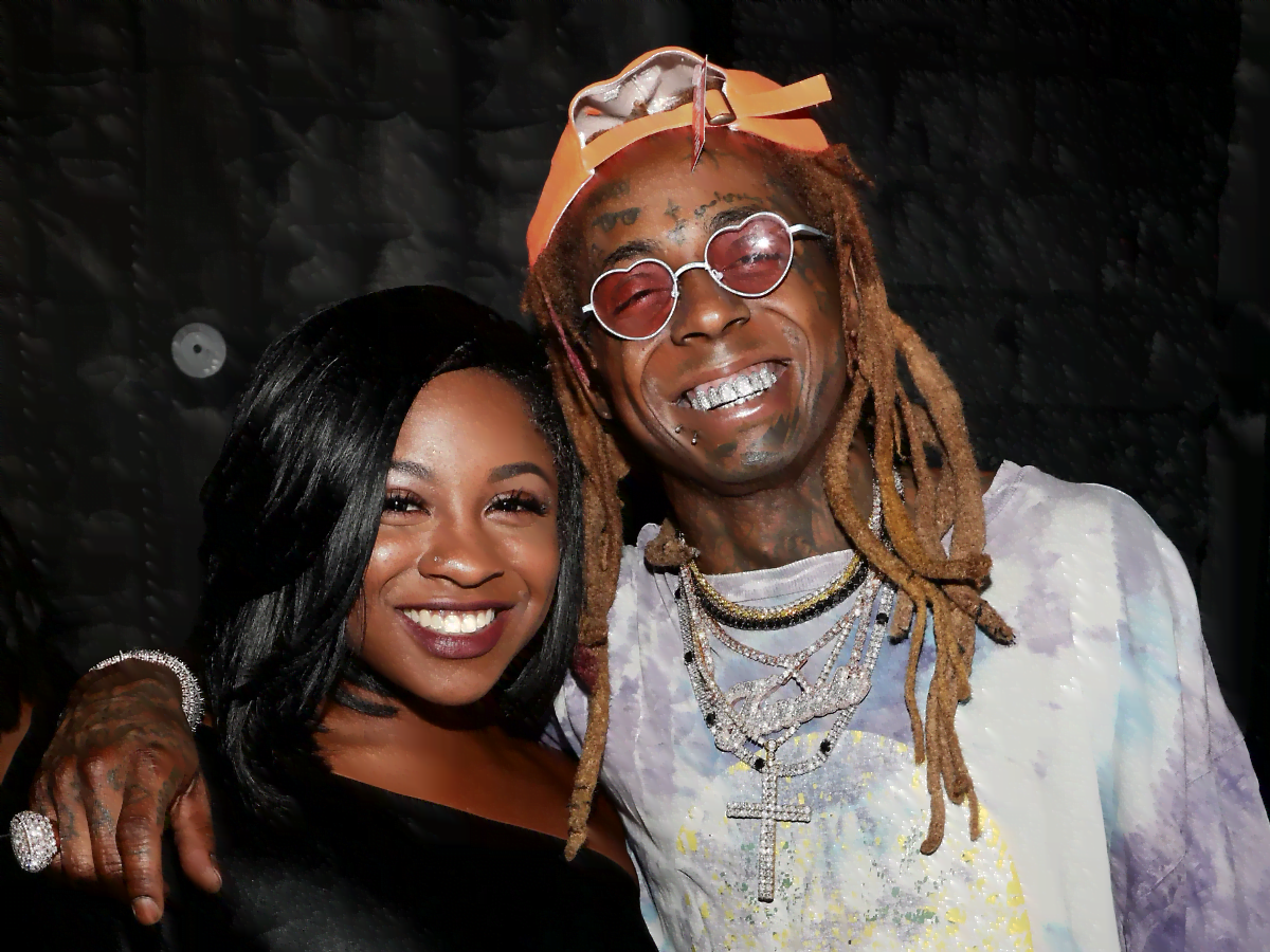 Reginae Carter Teases as She Slips in an Orange Lace Lingerie